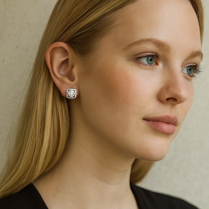 Crystal stud earrings with square halo and round clear stone on ear