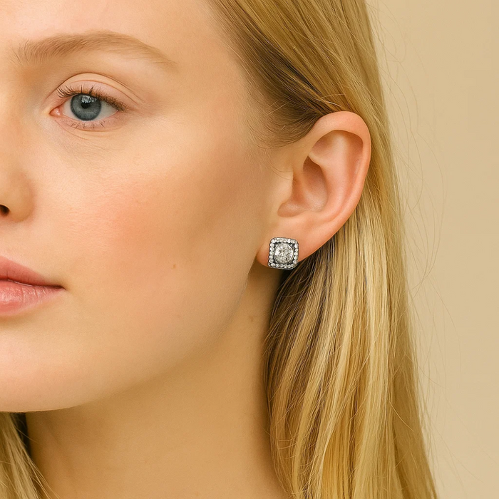 Crystal stud earrings with square halo and round clear center stone, close-up
