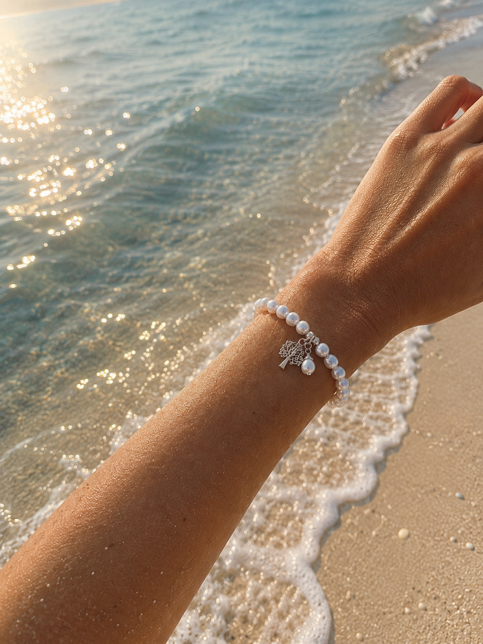 Kimberley Boab Pearl Silk Knot Adjustable Bracelet featuring genuine freshwater pearls, hand-knotted silk and sterling silver Boab tree charm.