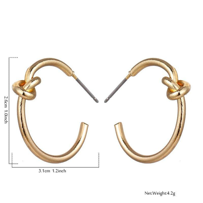 Gold knot hoop earrings with twisted knot detail on the front loop