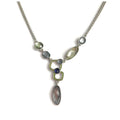 Silver statement necklace with faceted crystals in green, blue, and gray
