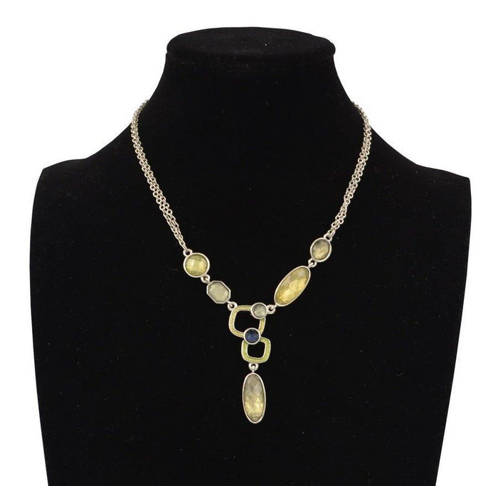 Gold-tone statement necklace with faceted yellow-green stones and crystal pendant