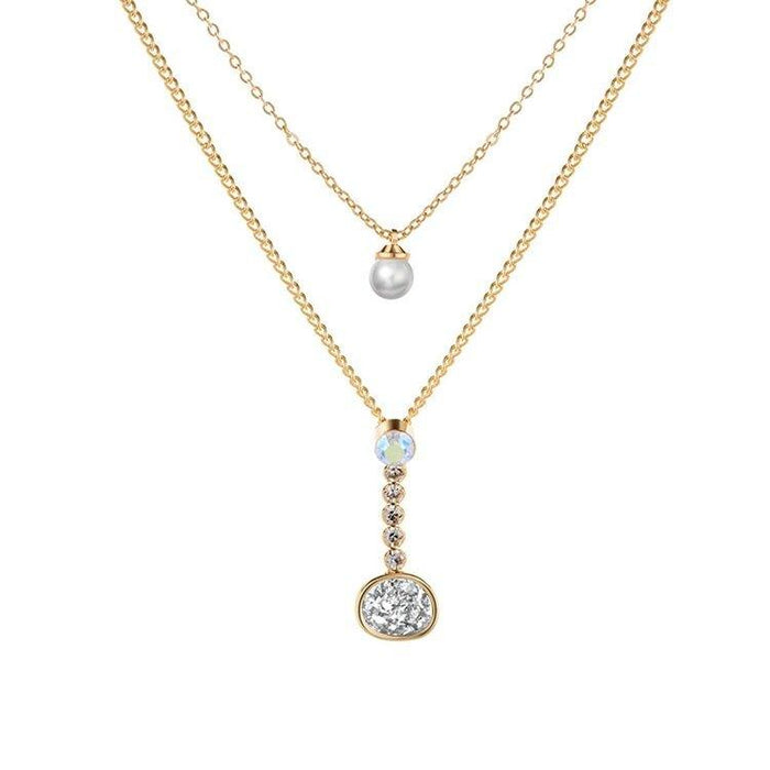 Layered gold-tone necklace with pearl, crystal, and round druzy-style pendant