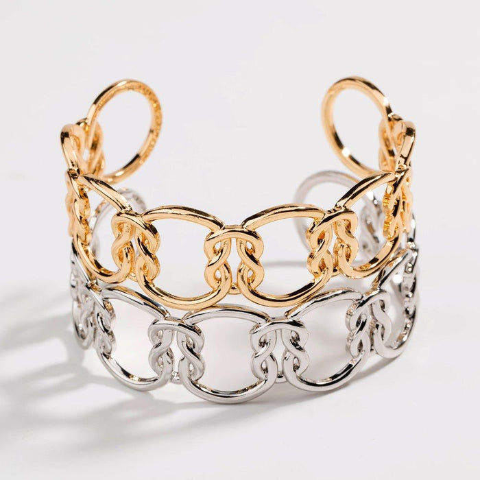 Two-tone love-knot link bracelet with gold top links and silver bottom links