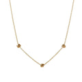 Gold-tone chain necklace with small love-knot pendant at the center