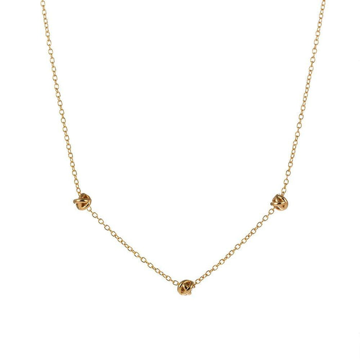 Gold-tone chain necklace with small love-knot pendant at the center