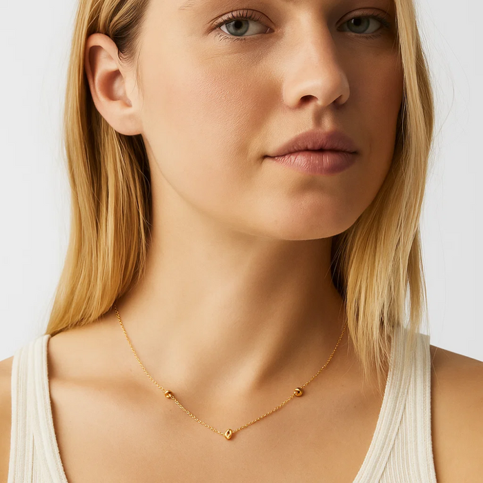 Gold-tone delicate chain necklace with love-knot charm