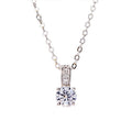 Cubic zirconia pendant necklace with round stone and vertical halo, silver-tone chain