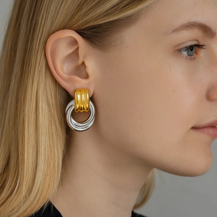 Mixed metal circle drop earring, gold curved top and silver ring drop