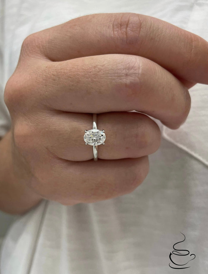 Moissanite. Sterling Silver 925 solitaire engagement ring with 1.5CT oval cut crispy clear moissanite.