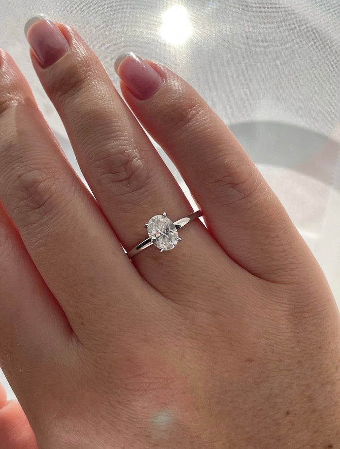 Moissanite. Sterling Silver 925 solitaire engagement ring with 1.5CT oval cut crispy clear moissanite.