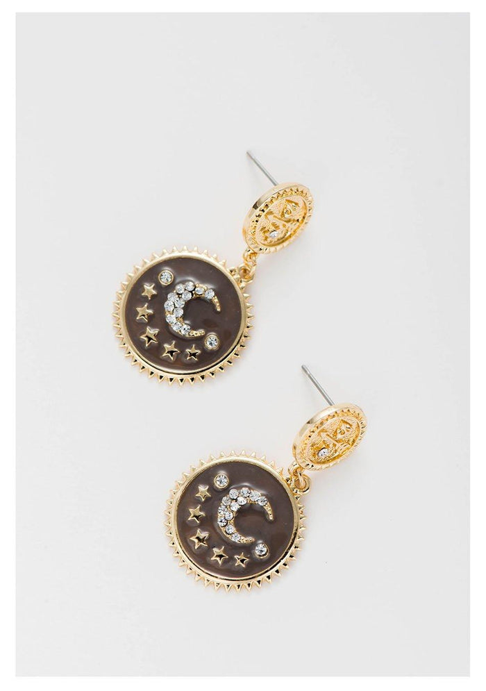 Gold-tone moon and star dangle earrings with dark round enamel and dangling stud tops