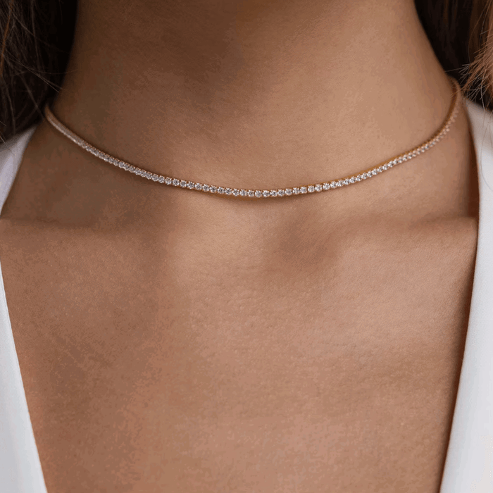 Silver-tone tennis necklace with a continuous row of round cubic zirconia