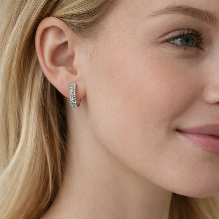 Nadia pavé huggie hoop earring in silver on ear