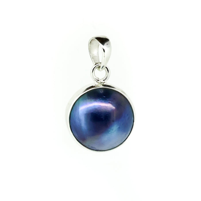 Ocean Blue Mabe Pearl Pendant crafted in sterling silver featuring a genuine Mabe pearl and vibrant blue gemstone inspired by tropical ocean waters.