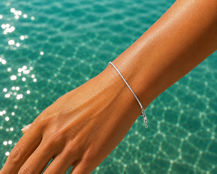 Minimalist Ocean Current Bracelet Silver crafted from 925 sterling silver with a delicate adjustable chain and polished silver finish.