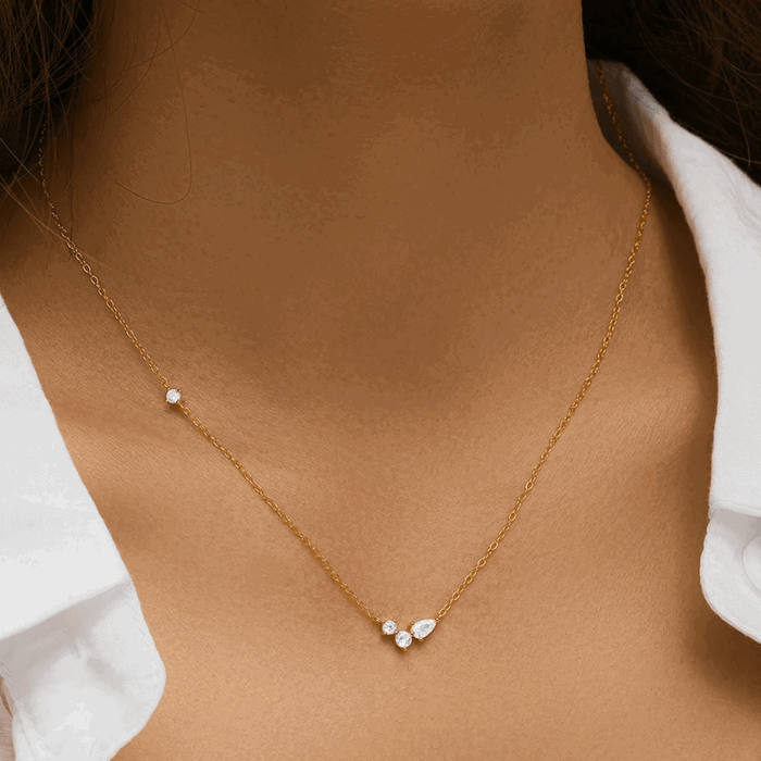 Gold-tone chain necklace with small round cubic zirconia stones at the front