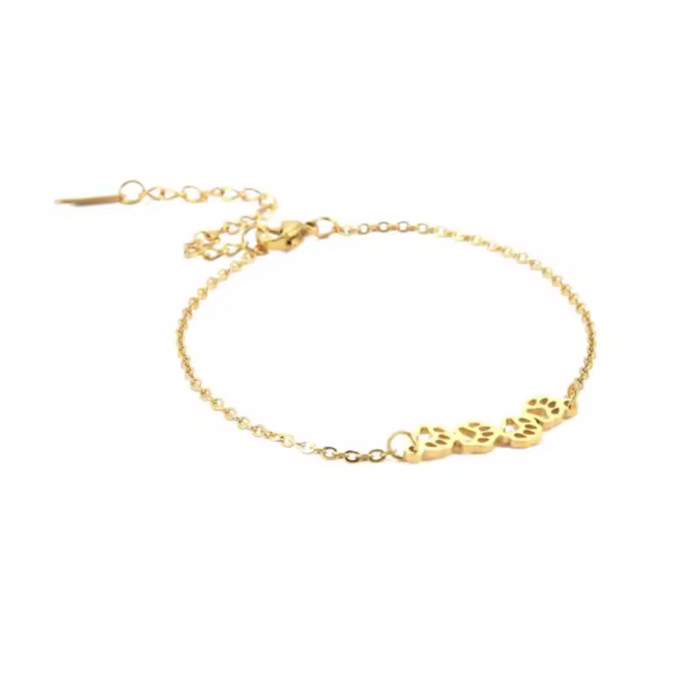 Gold paw-print link chain bracelet with small paw charms and lobster clasp