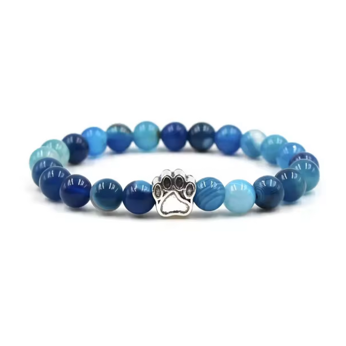 Blue gemstone-look bead bracelet with paw print metal charm center