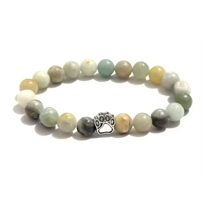 Pastel beaded bracelet with silver paw charm and round bead strands