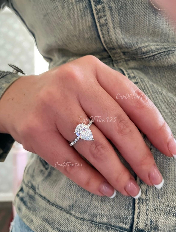 Pear cut ring with hidden halo. Sterling Silver 925 engagement ring with 3CT pear shaped simulated diamond and hidden halo.