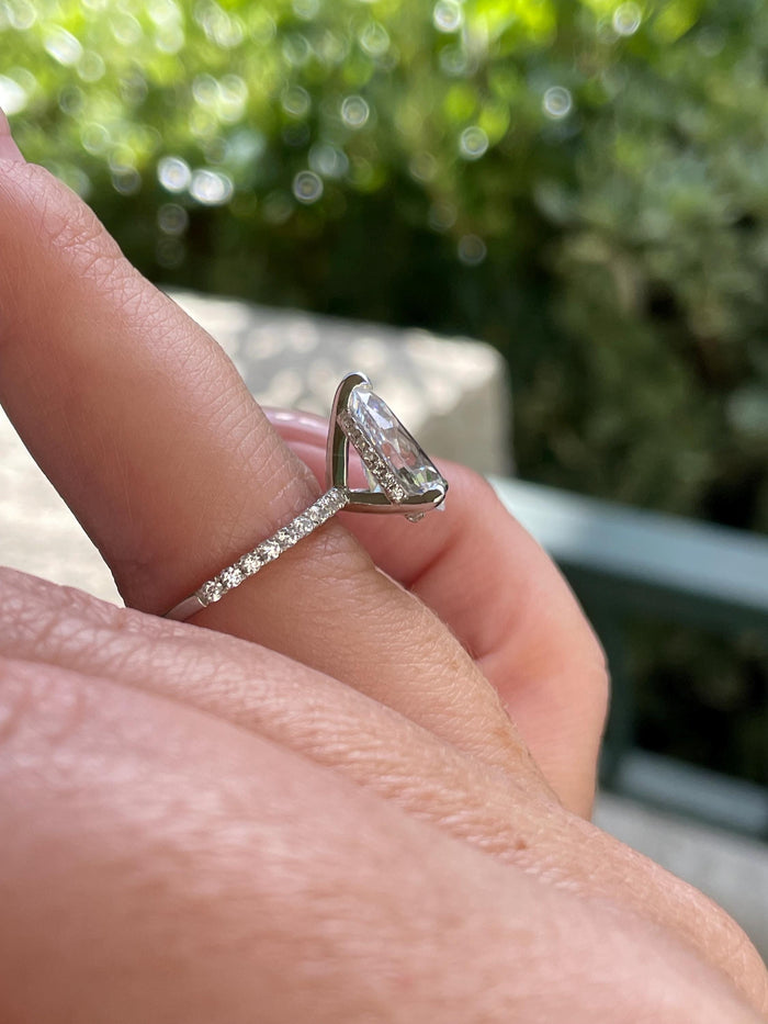 Pear cut ring with hidden halo. Sterling Silver 925 engagement ring with 3CT pear shaped simulated diamond and hidden halo.