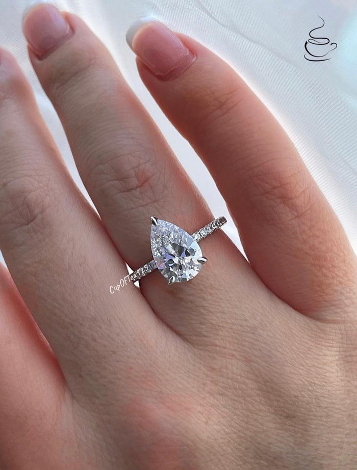 Pear cut ring with hidden halo. Sterling Silver 925 engagement ring with 3CT pear shaped simulated diamond and hidden halo.
