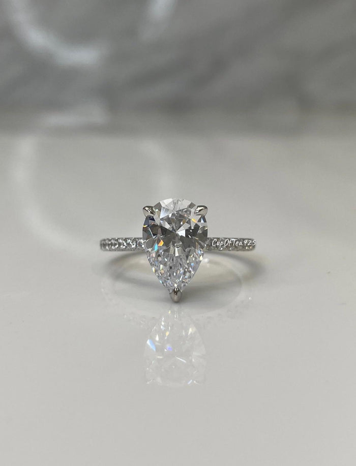 Pear cut ring with hidden halo. Sterling Silver 925 engagement ring with 3CT pear shaped simulated diamond and hidden halo.