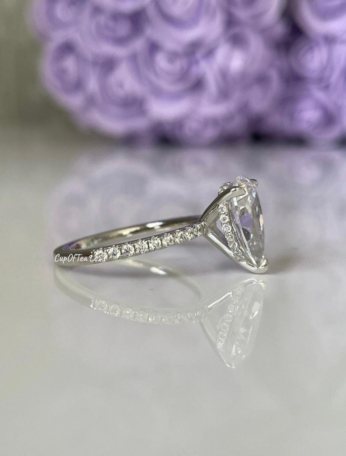 Pear cut ring with hidden halo. Sterling Silver 925 engagement ring with 3CT pear shaped simulated diamond and hidden halo.