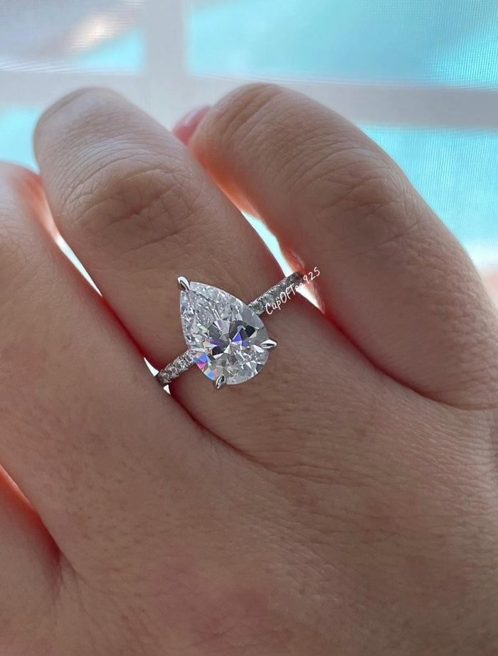 Pear cut ring with hidden halo. Sterling Silver 925 engagement ring with 3CT pear shaped simulated diamond and hidden halo.