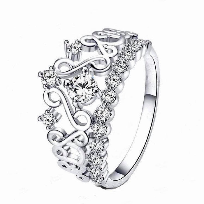Silver crown-style ring with cubic zirconia stones and decorative openwork sides