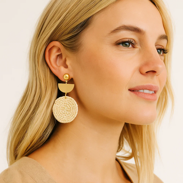 Woven straw round drop earrings with half-moon stud and gold-tone hook, on model