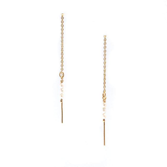 Rice Pearl Threads Gold featuring genuine freshwater rice pearls suspended on fine gold vermeil thread earrings over 925 sterling silver.