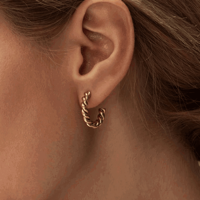 Gold twisted rope hoop earring with textured chain-like finish