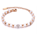 Rose gold pearl beaded bracelet with rhinestone center and lobster clasp