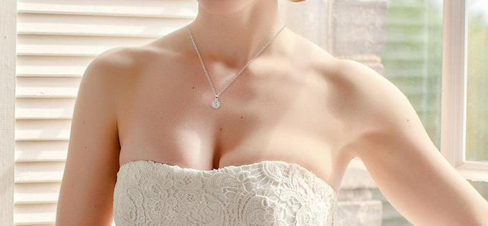 Round halo crystal pendant necklace on a thin silver chain