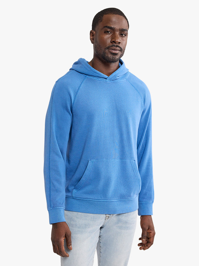 Man wearing a blue hoodie on a white background