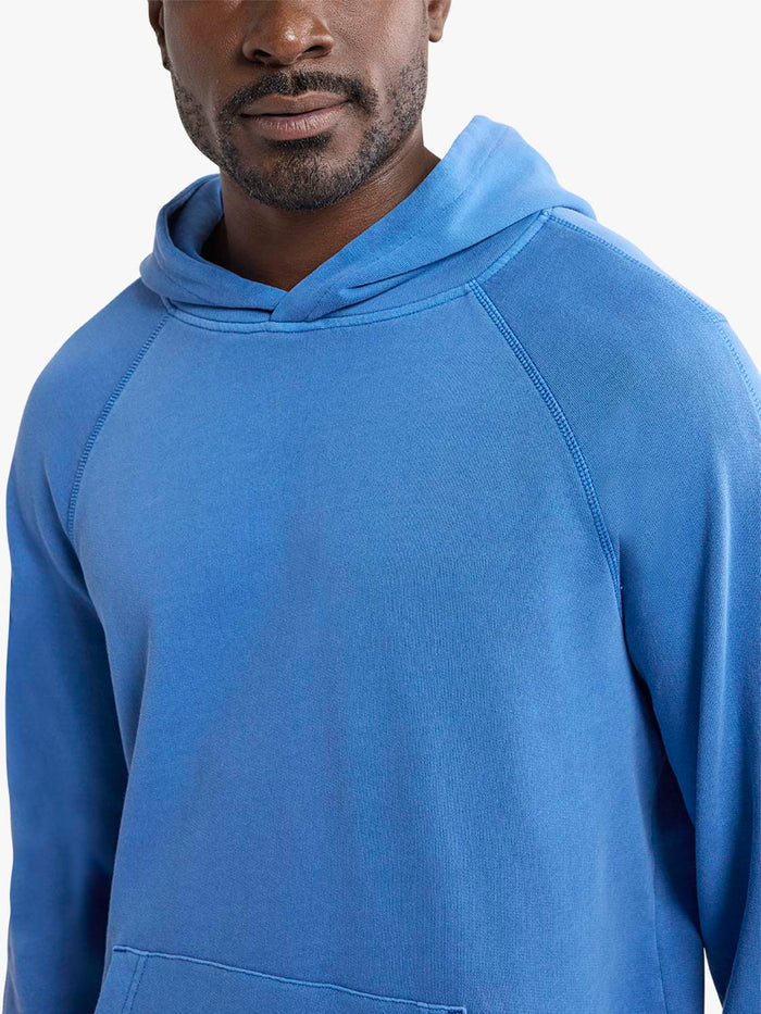 Man wearing a blue hoodie on a white background
