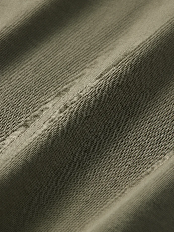 Close-up of olive green saltaire fabric