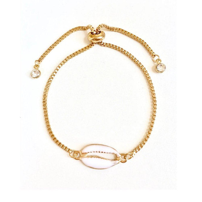 Gold seashell charm bracelet with adjustable spring clasp and small crystal beads.
