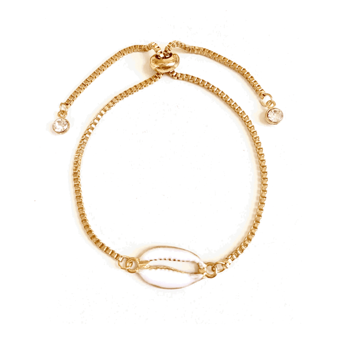 Gold seashell bracelet with beaded chain, oval shell center charm, and crystal accents