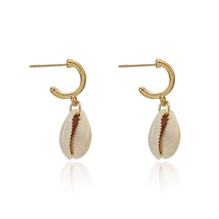 Gold hoop earrings with puka shell drops and ridged cowrie shell charm