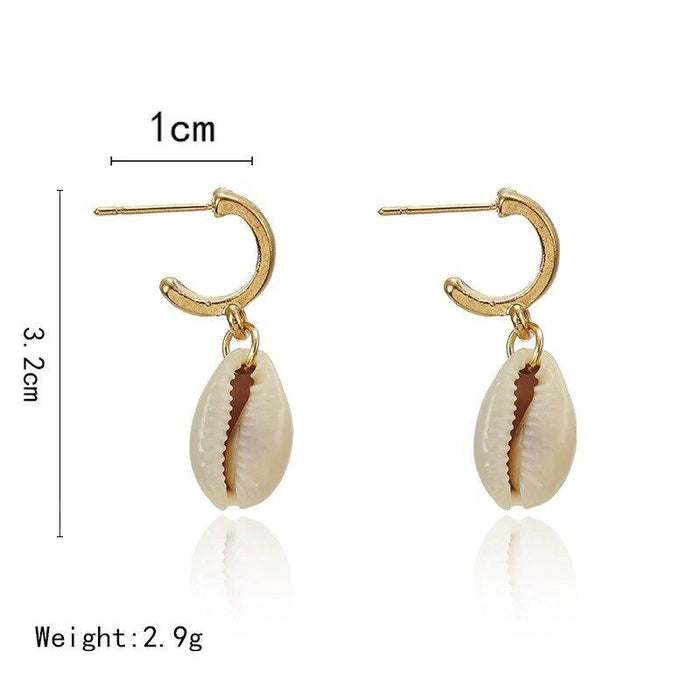 Gold hoop earrings with puka shell drop and ridged cowrie charm