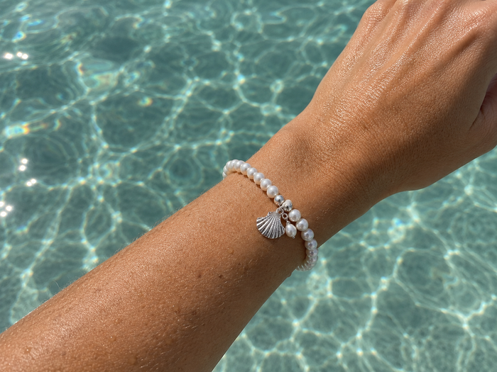 Pearl Silk Knot Bracelet Shell Pearl Charm featuring genuine freshwater pearls and a sterling silver shell charm.
