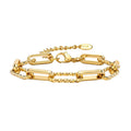 Gold paperclip chain bracelet, bar links with oval adjustment tag, flat lay