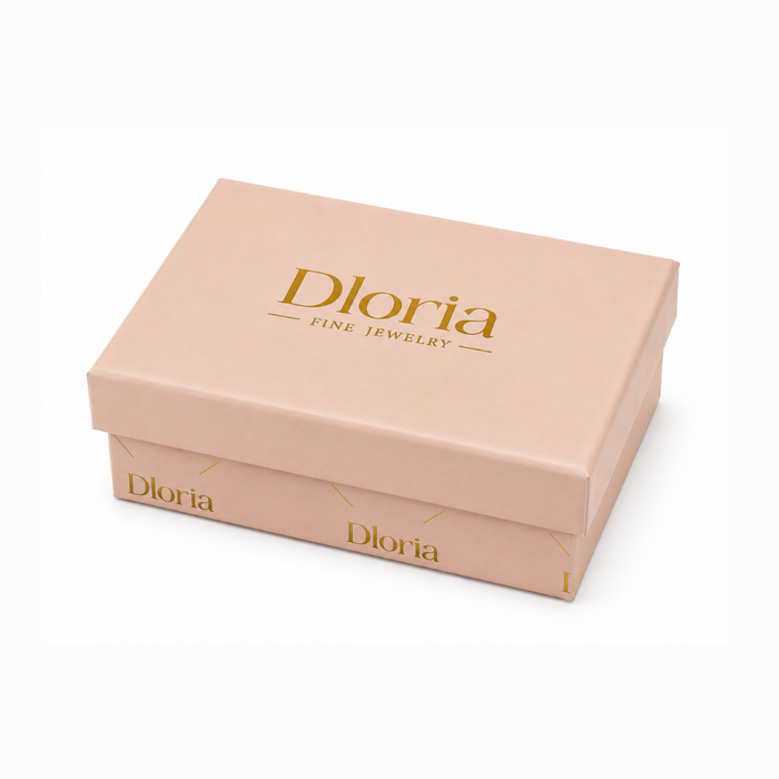 Gold jewelry box with “Dioria” logo text, hinged lid, gift-ready packaging