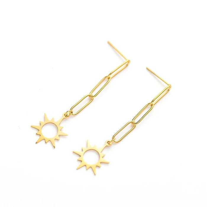 Gold-tone dangle earrings with elongated links and sunburst star pendants