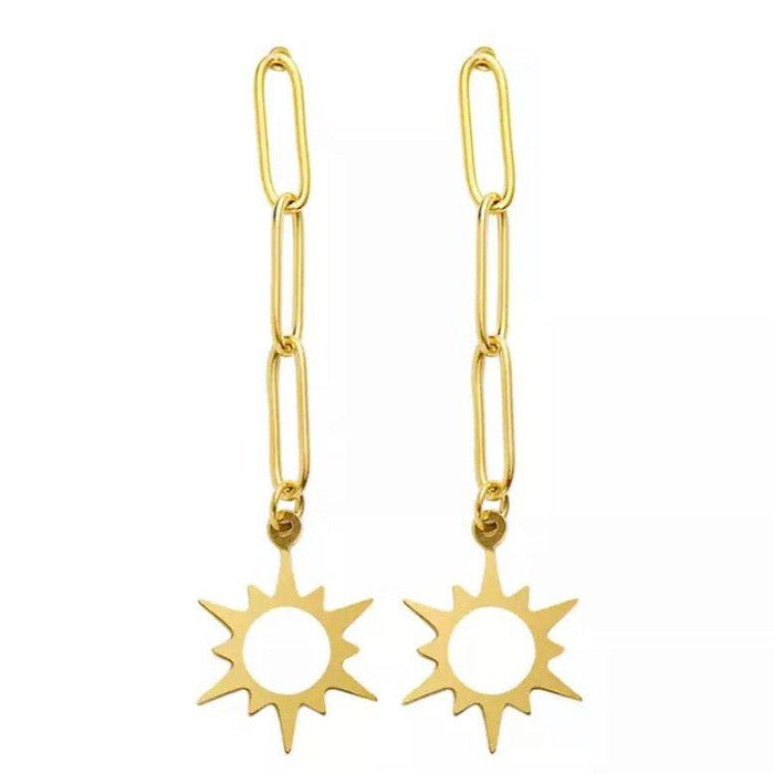 Gold-tone star dangle earrings with sunburst pendants and linked drops