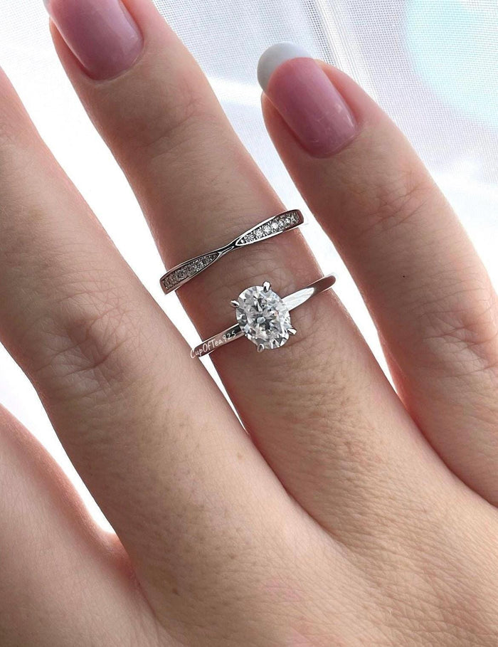 Sterling Silver 925 Bridal set with 1.5CT oval cut CZ simulated diamond solitaire engagement ring and curved moissanite band.