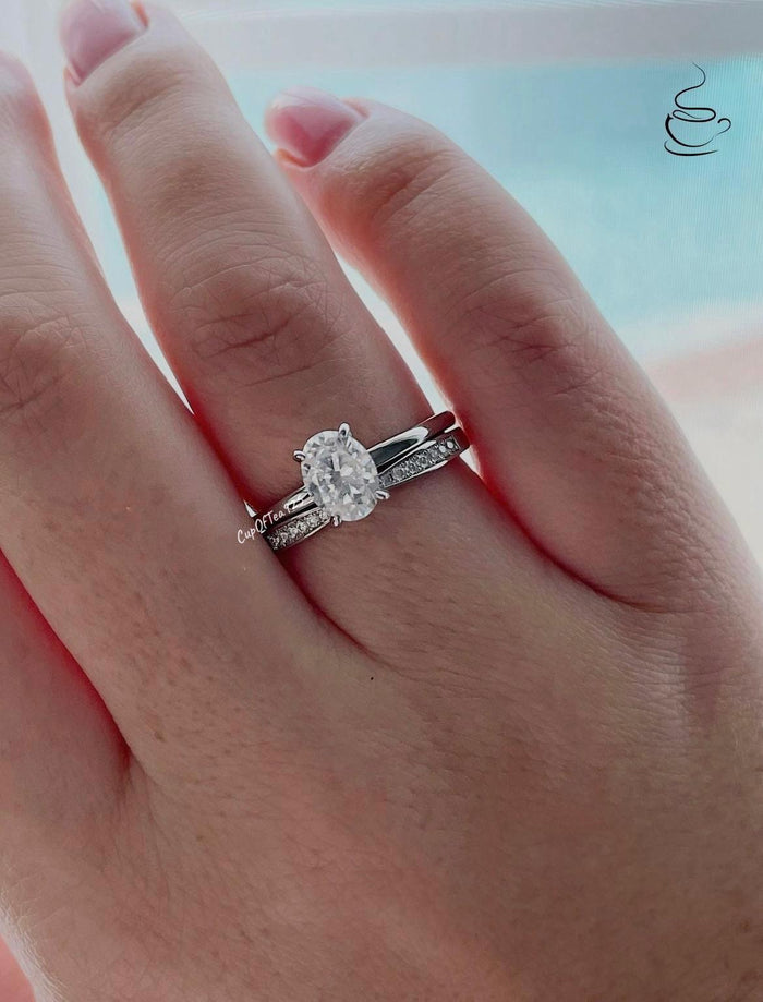 Sterling Silver 925 Bridal set with 1.5CT oval cut CZ simulated diamond solitaire engagement ring and curved moissanite band.